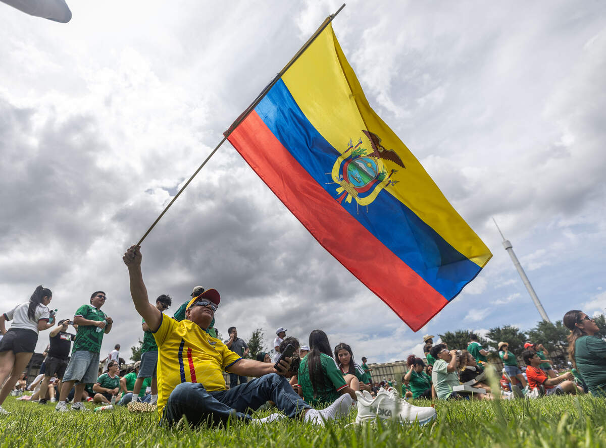 Jaime Fiallos waves an Ecuadorian flag during the FIFA Fan Festival on Thursday, June 11, 2026, at Fair Park in Dallas. Ecuador's first game will be against the Ivory Coast on June 14, 2026.