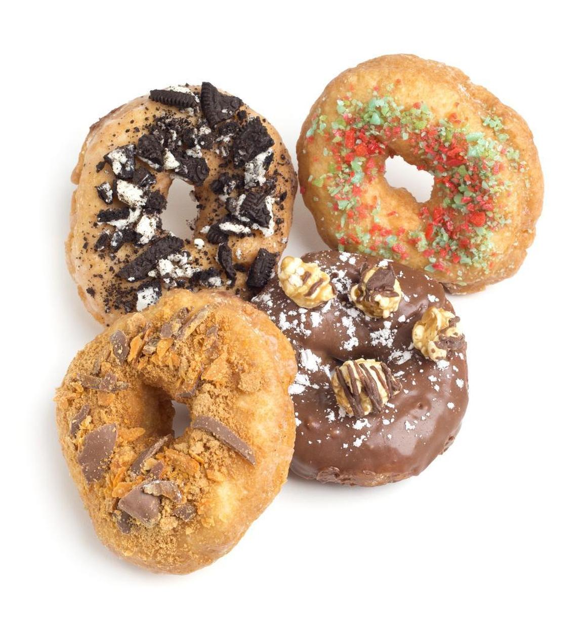 Oreo Crush, Mary Poppins (pop rocks), Nutella popcorn and Butterfinger doughnutes from Kneady Donuts, scheduled to open in late March in Fort Worth