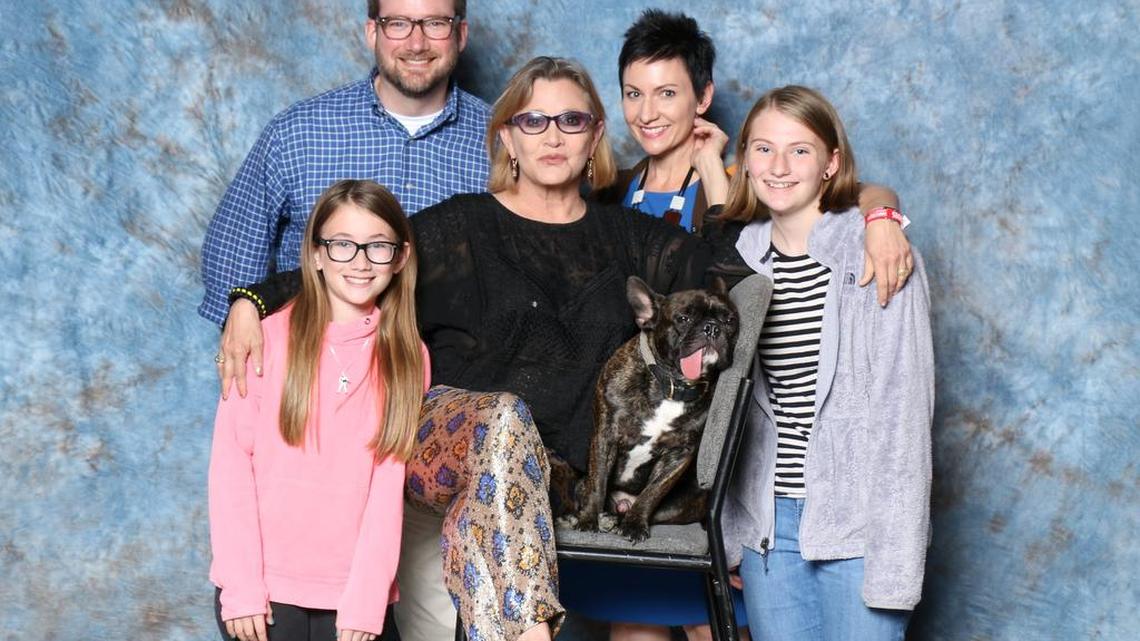 The Davis family with Carrie Fisher and her dog Gary. The picture was taken during Dallas Fan Days on May 31, 2015.