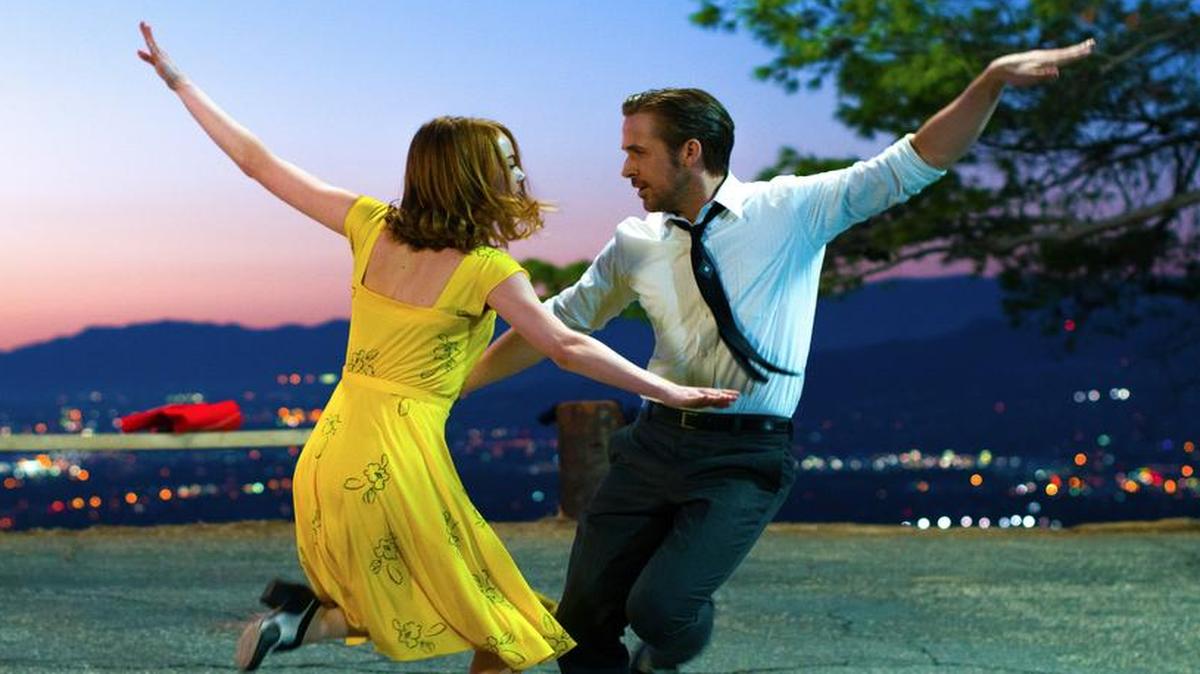 This image released by Lionsgate shows Emma Stone, left, and Ryan Gosling Stone in a scene from, “La La Land.” The film was nominated for an Oscar for best feature film. The 89th Academy Awards will take place Feb. 26.