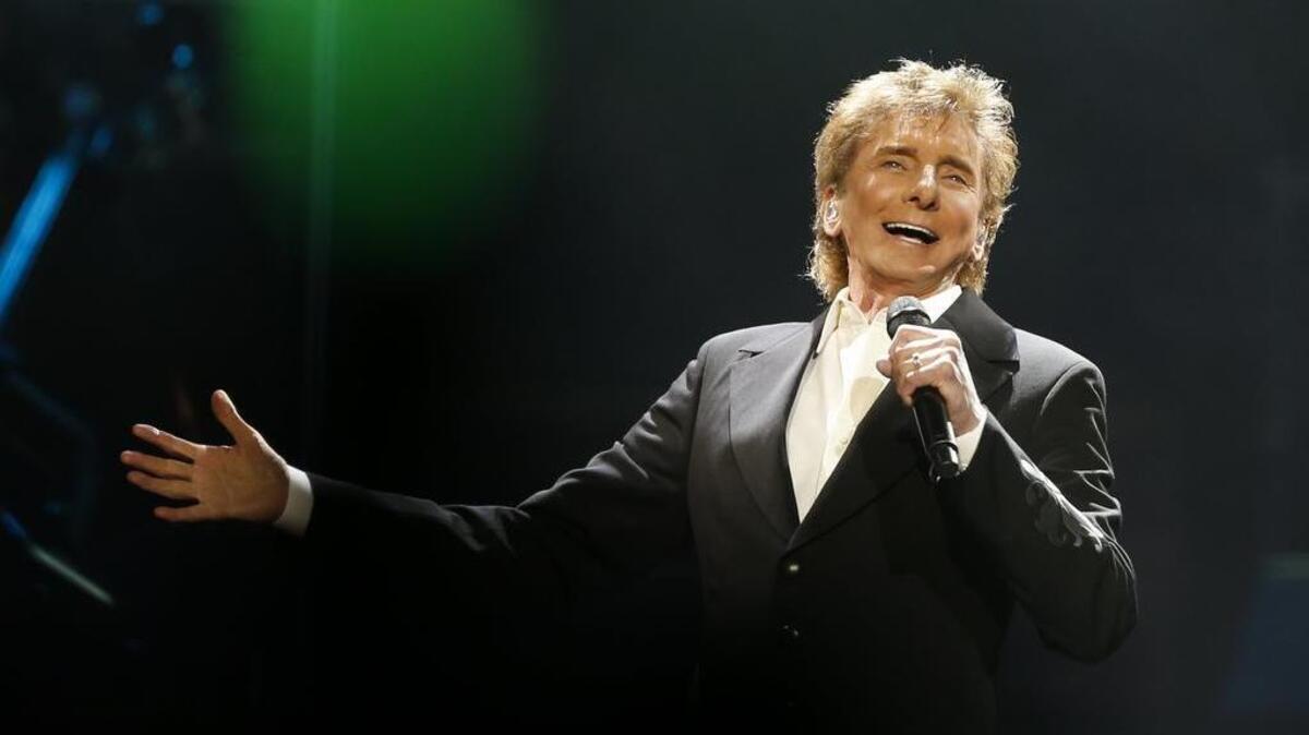 Barry Manilow performs in concert, Feb. 18, 2016, at the American Airlines Center in Dallas, Texas.