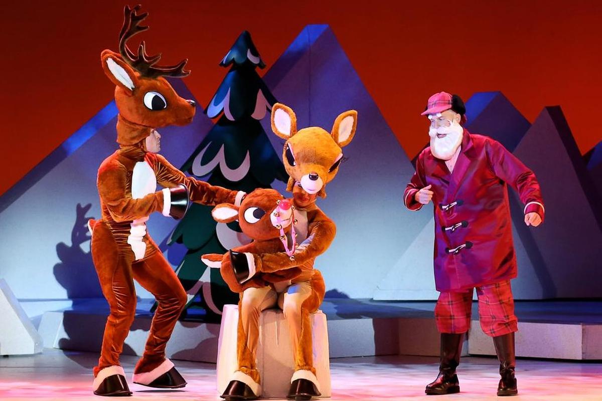 Rudolph family and Santa in Rudolph the Red-Nosed Reindeer: The Musical.