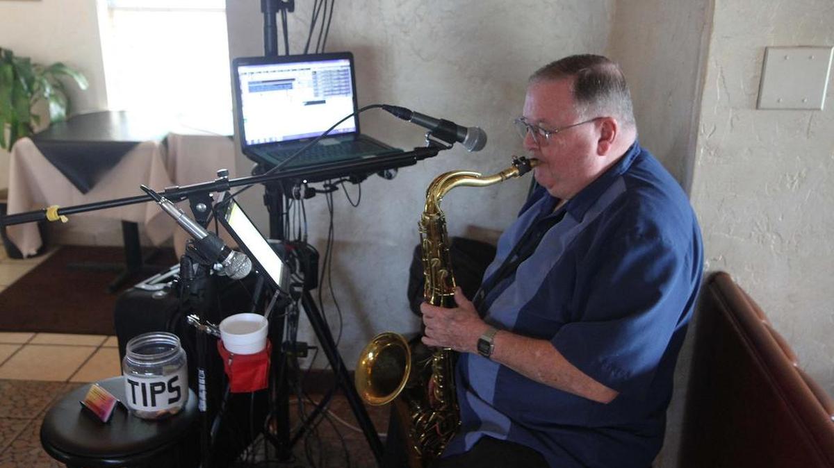Haden plays for diners using his saxophone and a computer, which provides musical accompaniment.