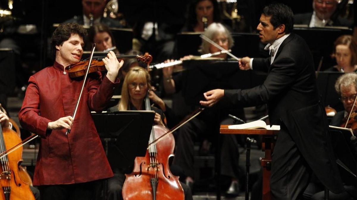 The Fort Worth Symphony Orchestra, led by Miguel Harth-Bedoya, right, will perform with violinist Augustin Hadelich.