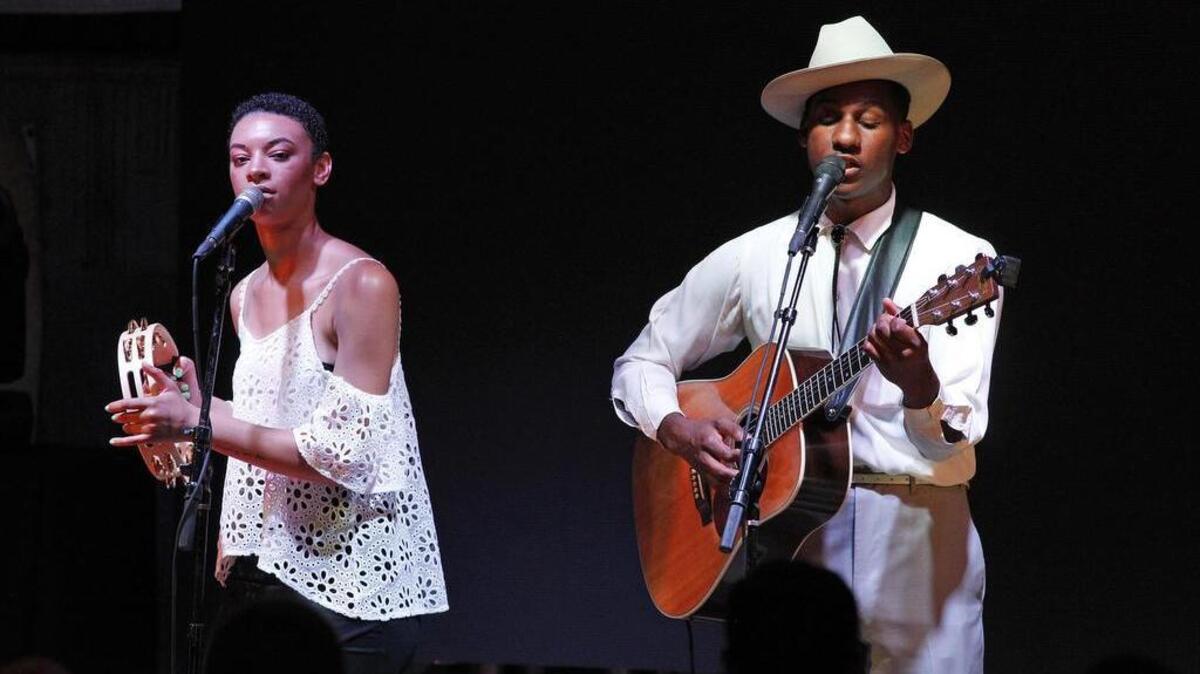 Brittni Jessie (left) and Leon Bridges (right) perform a acoustic set at Shipping & Receiving Bar in Fort Worth as part of a benefit screening of his mini-documentary “This is Home,” June 29, 2016.