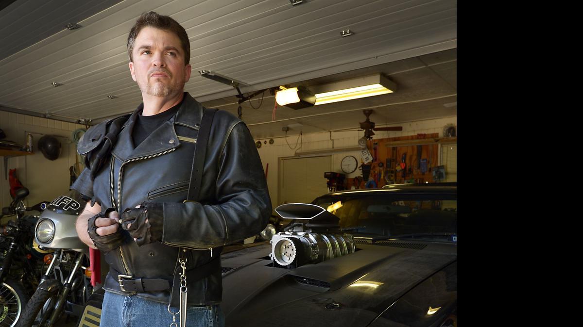 
Jake Sposato and his Interceptor in his garage. 

