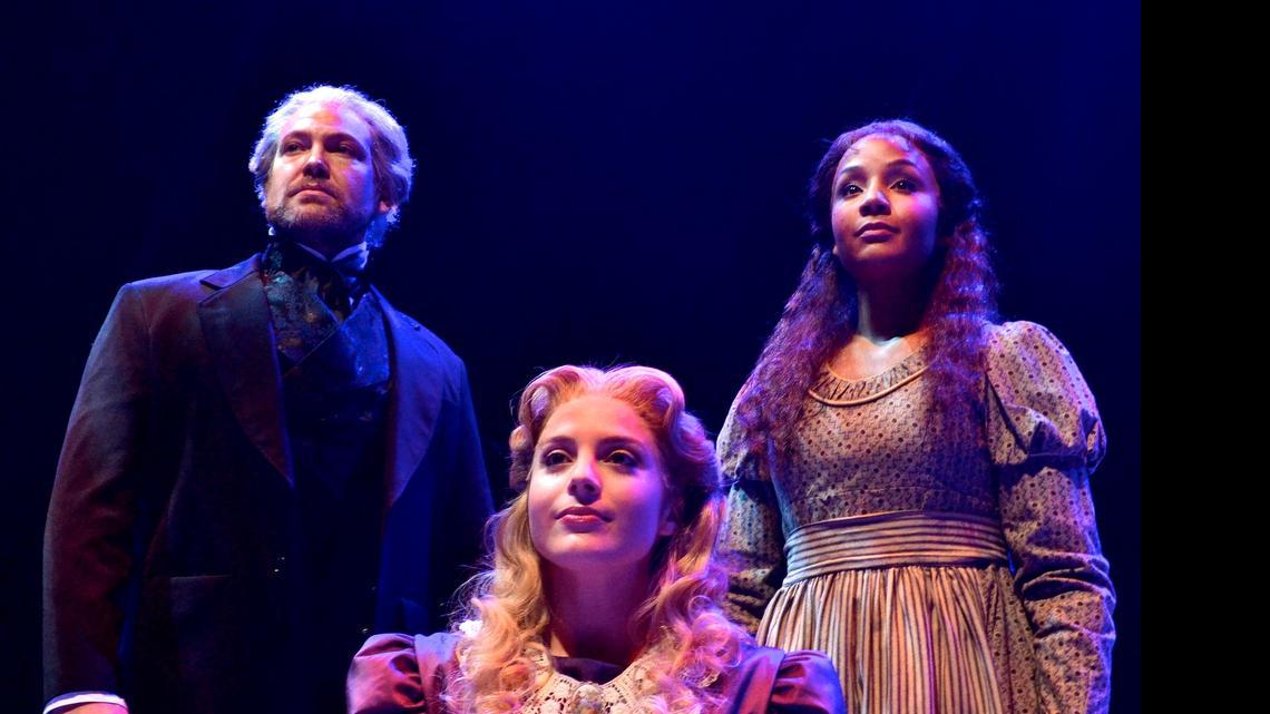  Michael Hunsaker as Valjean, Mary Michael Patterson as Cosette, center, and Stephanie Umoh as Fantine.
