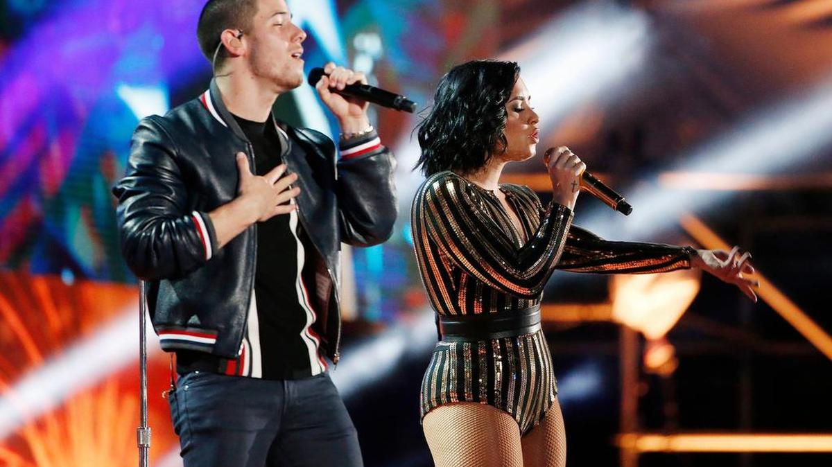 Nick Jonas and Demi Lovato have teamed up before. Here, they rehearse for the 2016 Boston Pops Fireworks Spectacular.