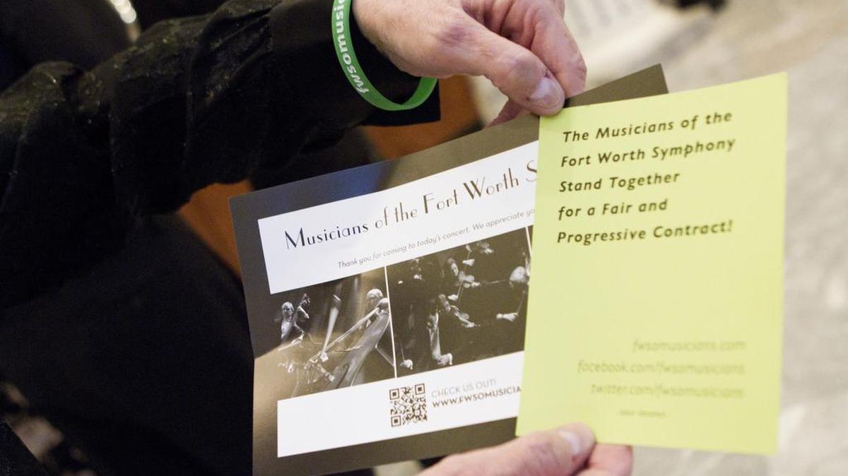 The Fort Worth Symphony Orchestra musicians hand out leaflets to make patrons aware of their upcoming contract negotiations before a recent performance at Bass Hall.
