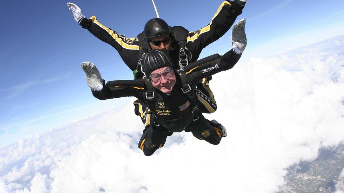 Former President George H.W. Bush is shown during his free fall with U.S. Army Golden Knights parachute team member, Sgt. 1st Class Mike Elliott, as he made his entrance to his presidential museum during a rededication ceremony in College Station, Texas, on Saturday, Nov. 10, 2007.