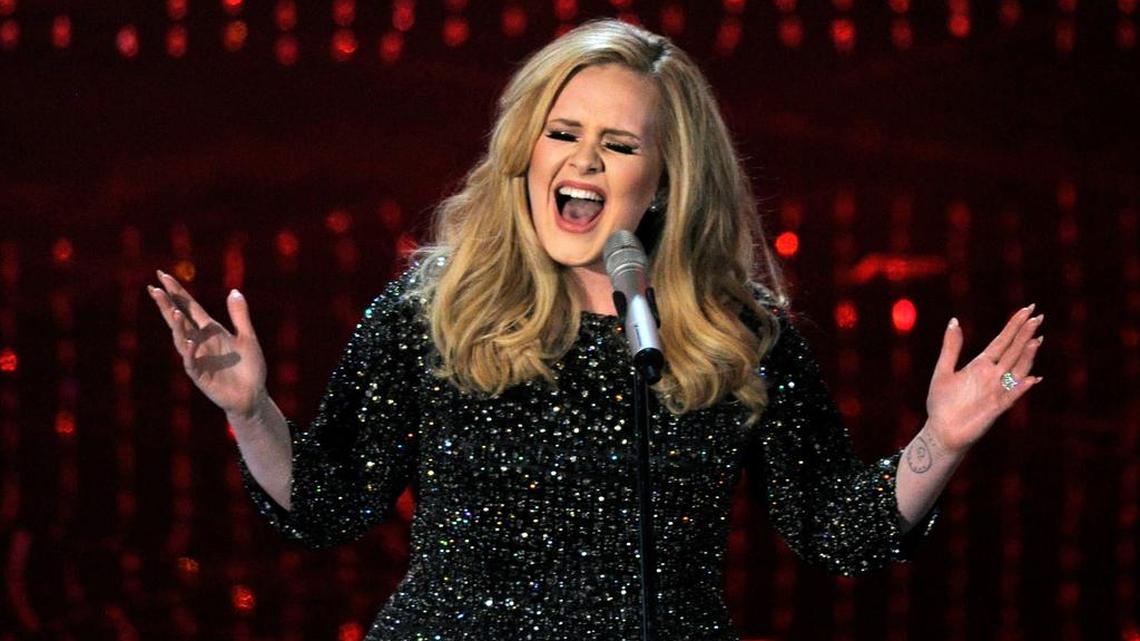 In this Feb. 24, 2013 file photo, Adele performs during the Oscars at the Dolby Theatre in Los Angeles.