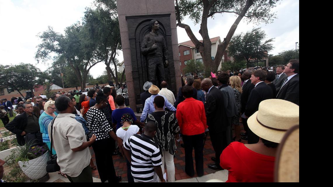 
A statue of Timothy Cole is unveiled during a ceremony in Lubbock, Texas, on Wednesday, Sept. 17, 2014, 28 years to the day after he was falsely convicted of raping a Texas Tech student.
