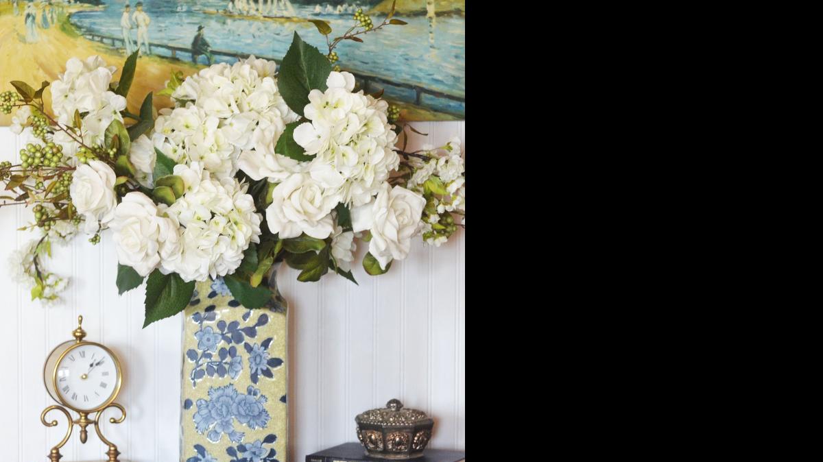 
An oversize arrangement in a limited color palette adds beauty to a hall entry.

