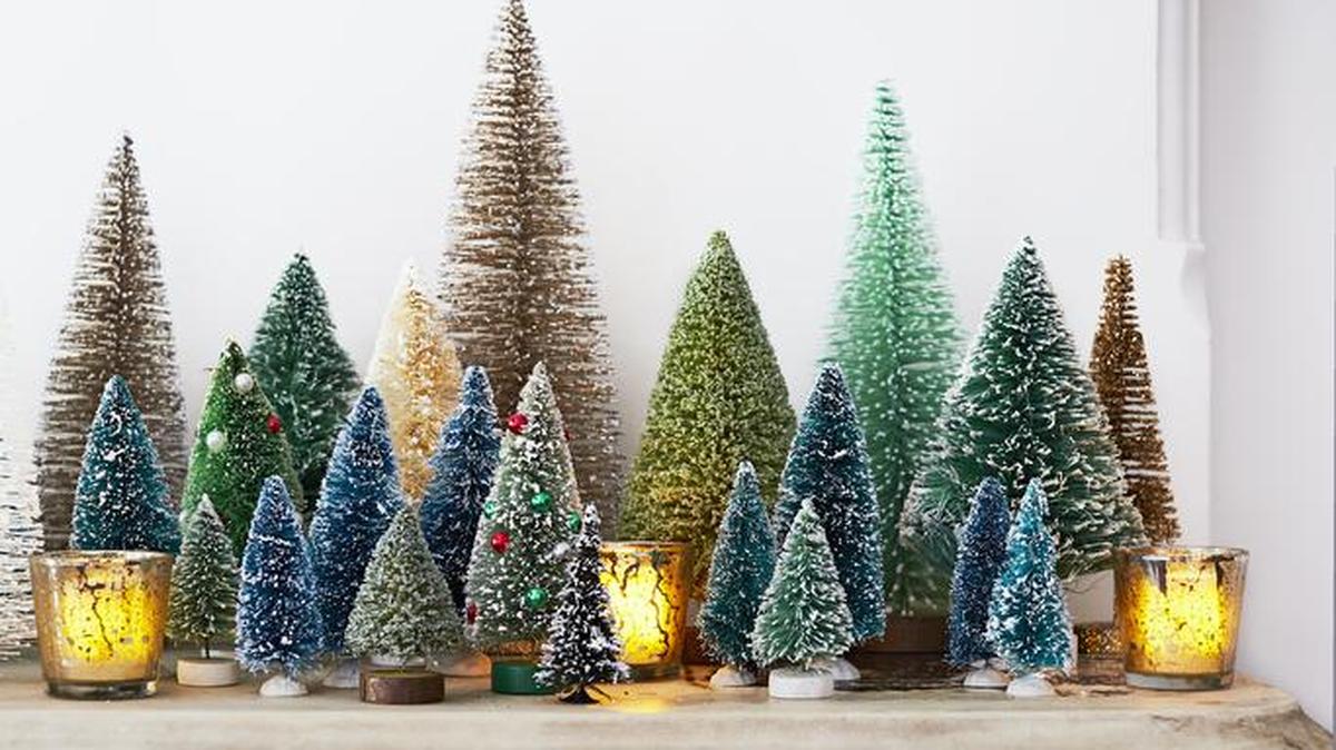 Mix them up on the mantel: These festive fir trees say Christmas through and through