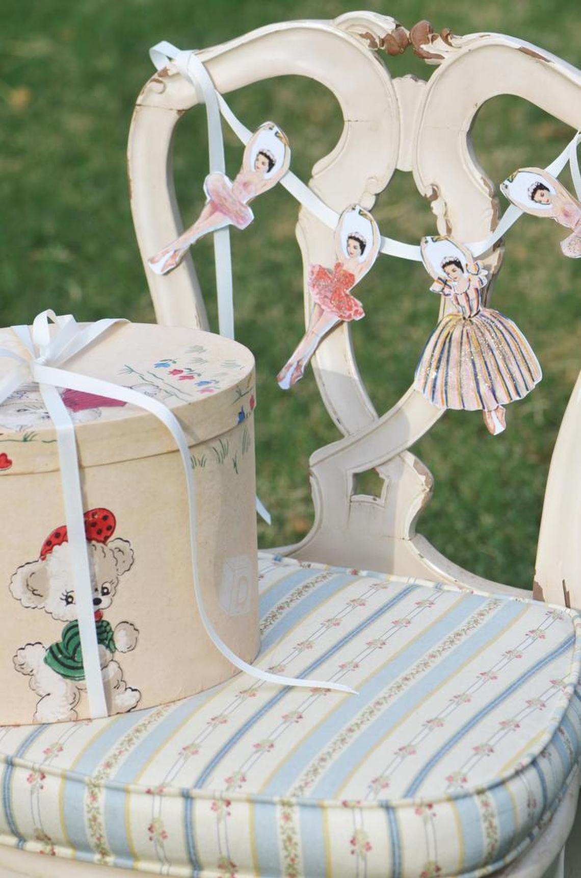 This garland uses cutouts of ballerinas that have been hand-colored and glued to a ribbon. Images used must be in the public domain.