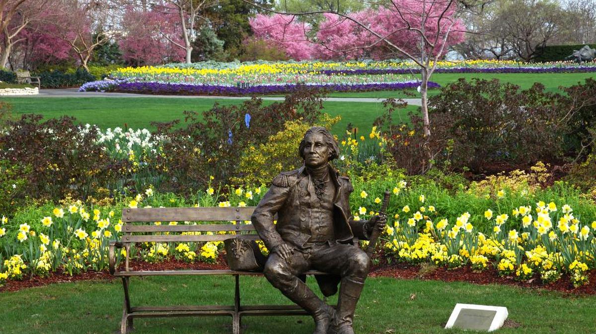 Dallas Blooms, at the Dallas Arboretum and Botanical Garden, has a new addition this year: life-size bronze sculptures of notable people in history, including William Shakespeare, Mark Twain and George Washington, pictured.