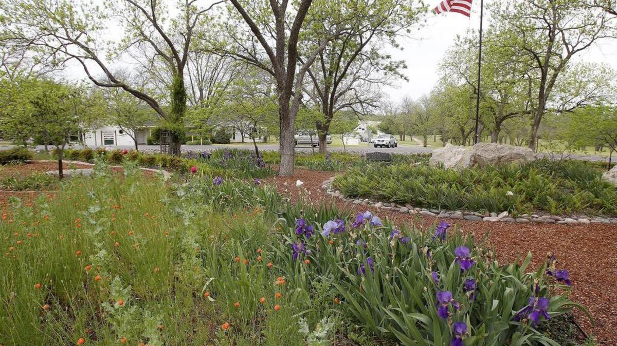 Neighbors decided the traffic circle space just through the front gate at Pecan Plantation was the perfect spot for a garden.
