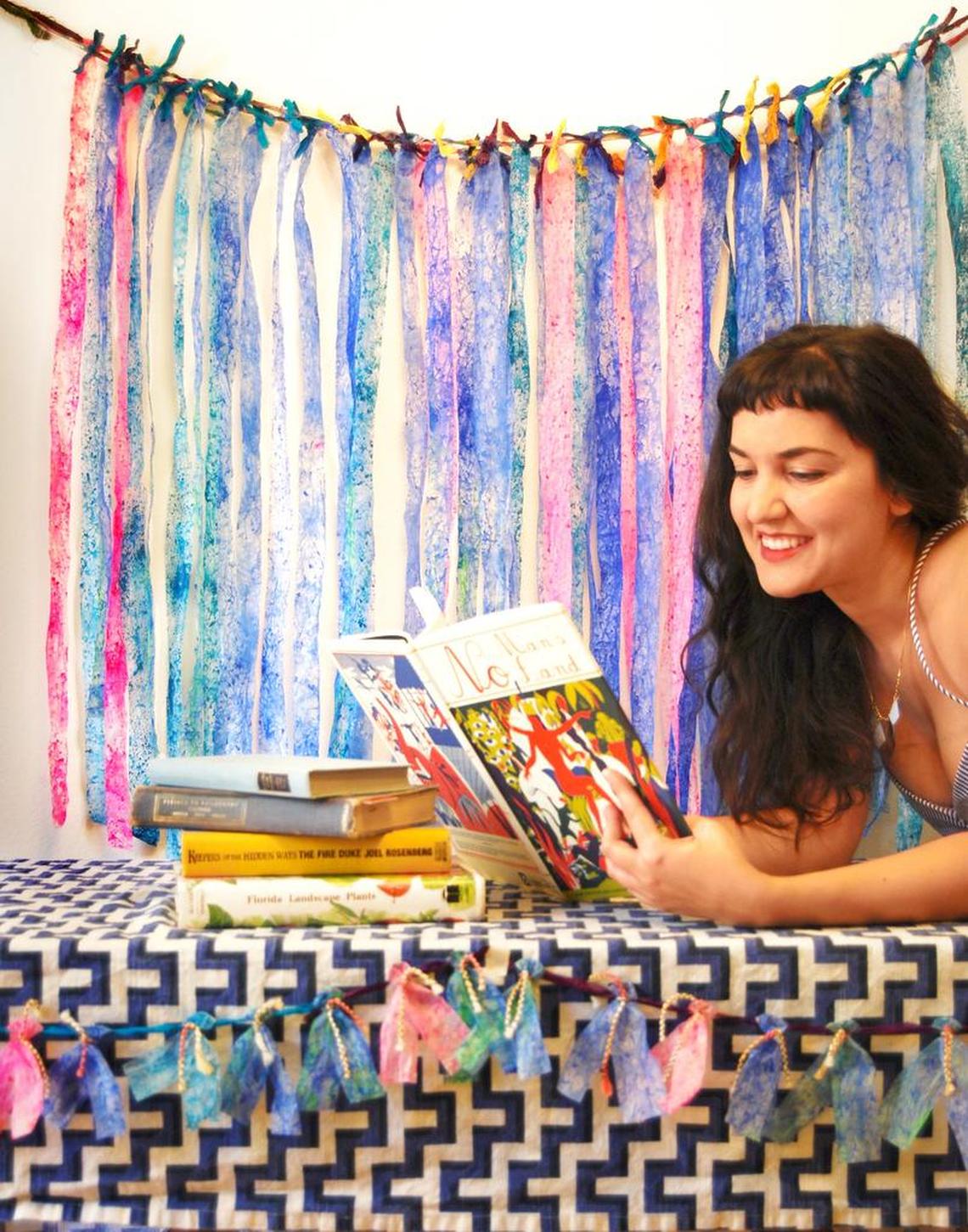 Shamsy Roomiani with a hand-tied and dyed batik paper on a main cord comprosed of recycled t-shirt material and “silk tidbits.”