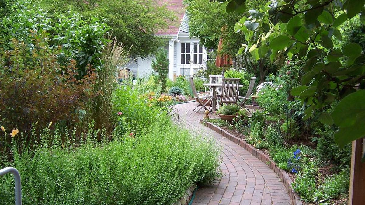 Designing a path begins with determining whether the garden is formal or informal. A formal-style path typically includes straight lines. Informal paths tend to have soft curving lines.