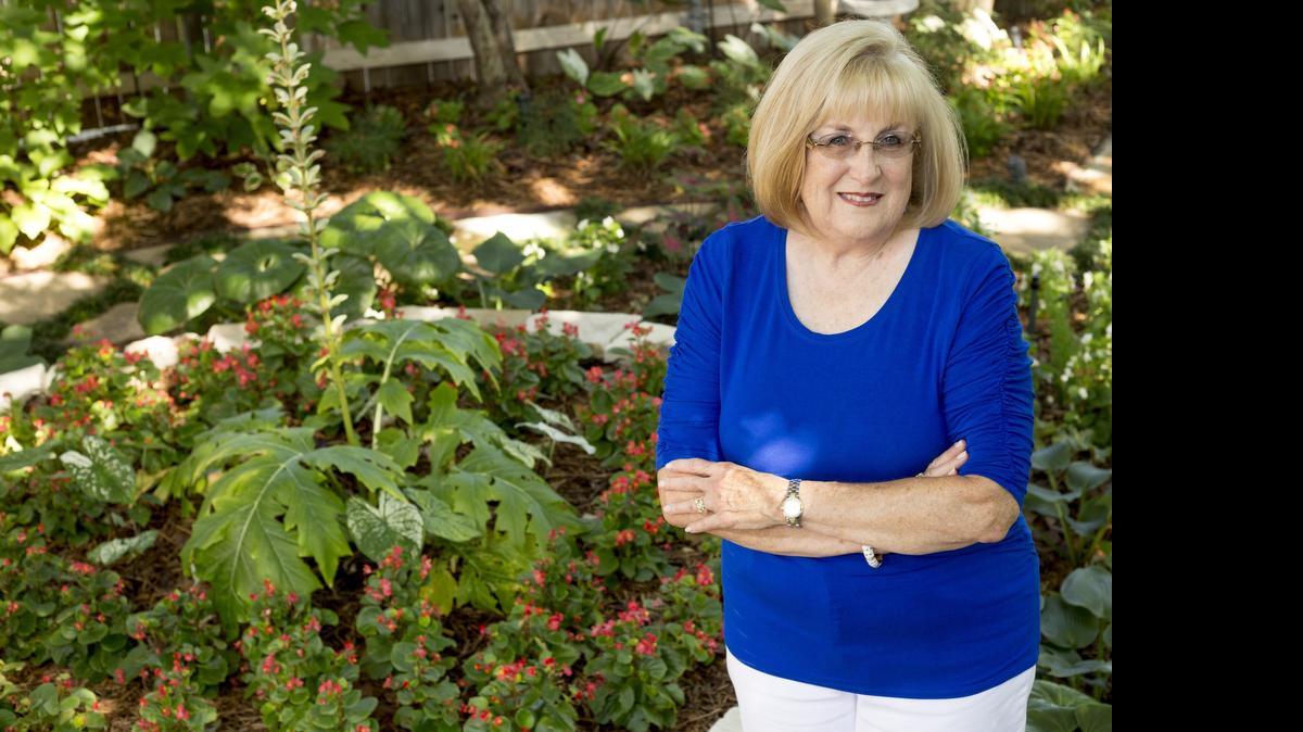 
Linda Ezell, an actuary by profession, says her passion is working in her yard. She estimates there are more than 25 plants and two tons of rock to be found in the lush garden of her Arlington home. 
