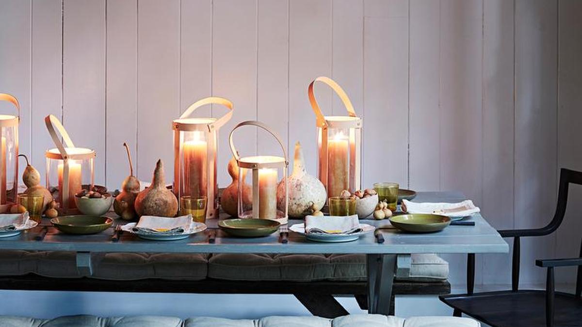 Mix earthy, warm elements to create a welcoming fall-inspired dinner table.