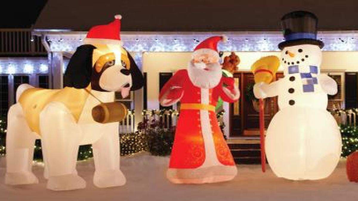 Newer inflatables are truly larger than life. These are 12 feet tall. <252><137>My snowman’s bigger. For those trying to one-up the neighbors with a bigger set of lawn toys, newer animated inflatables are truly larger than life. Some stand 20-feet. Those pictured here are 12 feet tall. Photo courtesy of Home Depot.<252><137>