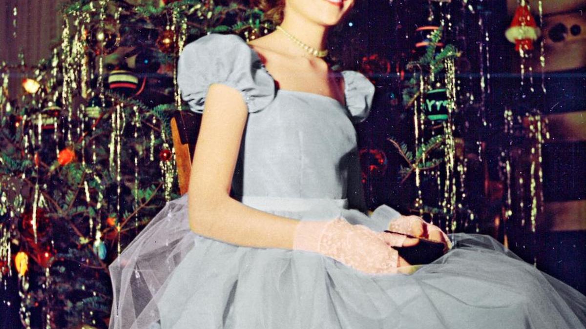 This picture of Martha, at 14 and wearing her first formal dress, was taken by her father in front of the Kostyra family Christmas tree.