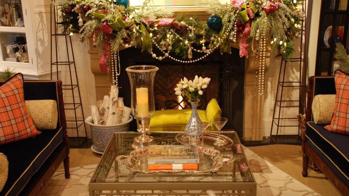 When it comes to designing an elaborate holiday mantel, a beautiful garland of mixed-color greens serves as both a base and a muse.