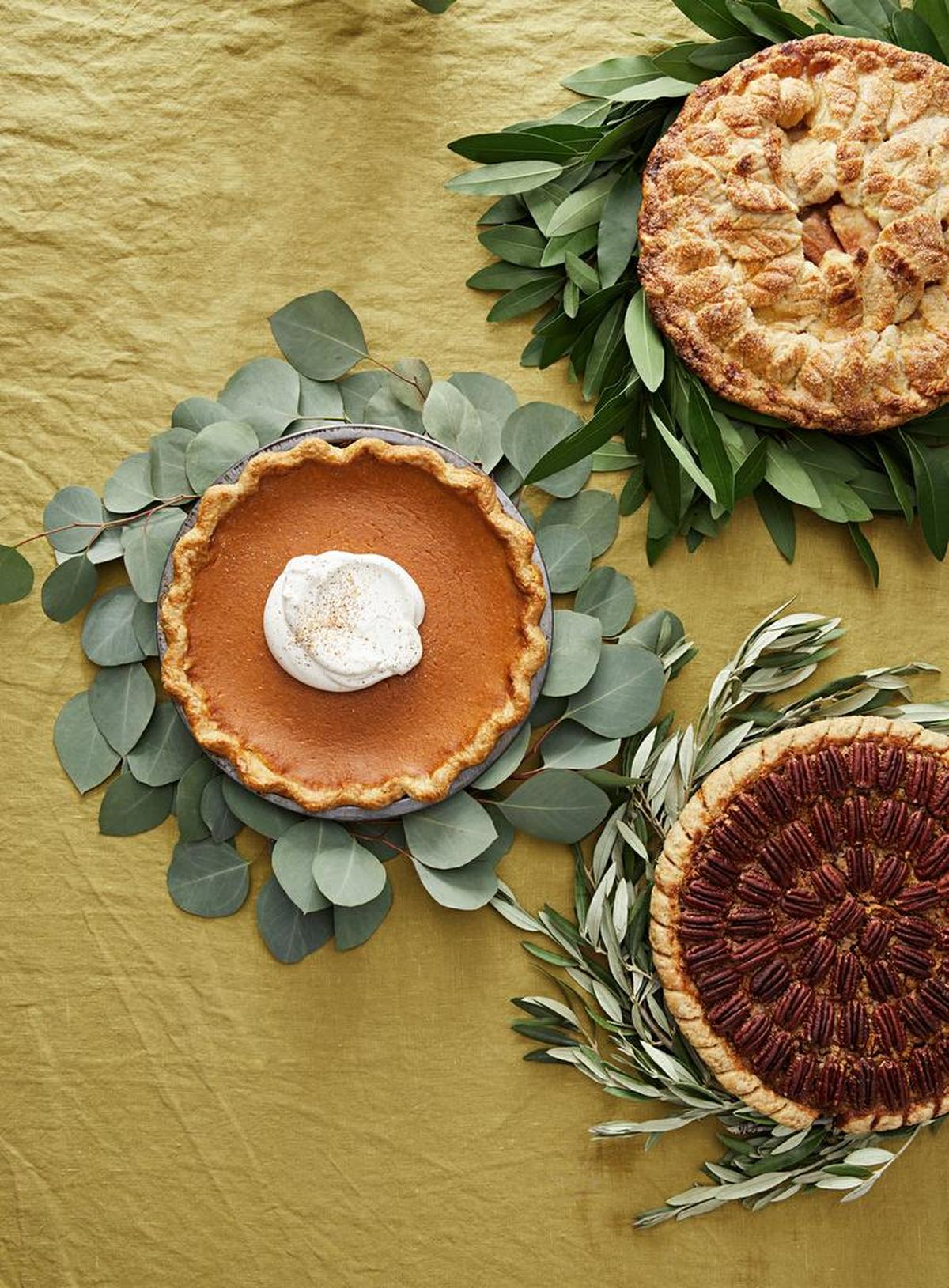 These pie collars will make your dessert table more festive: (clockwise, from top right) bay leaf, olive and eucalyptus.