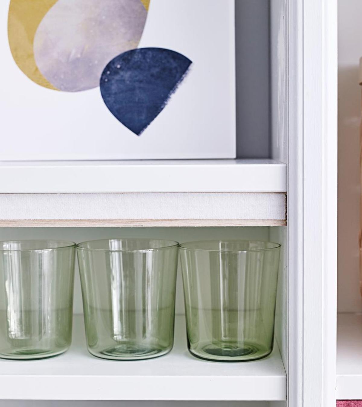 It’s easy to cover up shelves holding things you may not want to display — like these glasses for example.