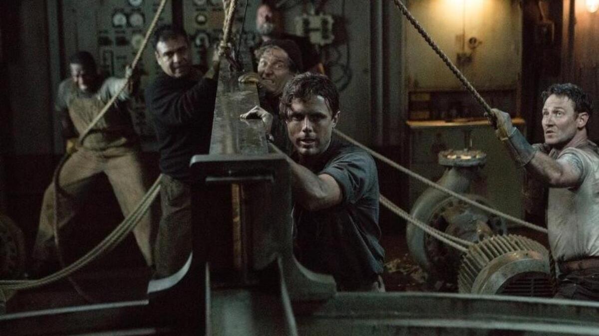 Casey Affleck, as the Pendleton’s chief engineer Ray, heads up the ship’s crew after its captain is killed in “The Finest Hours.”