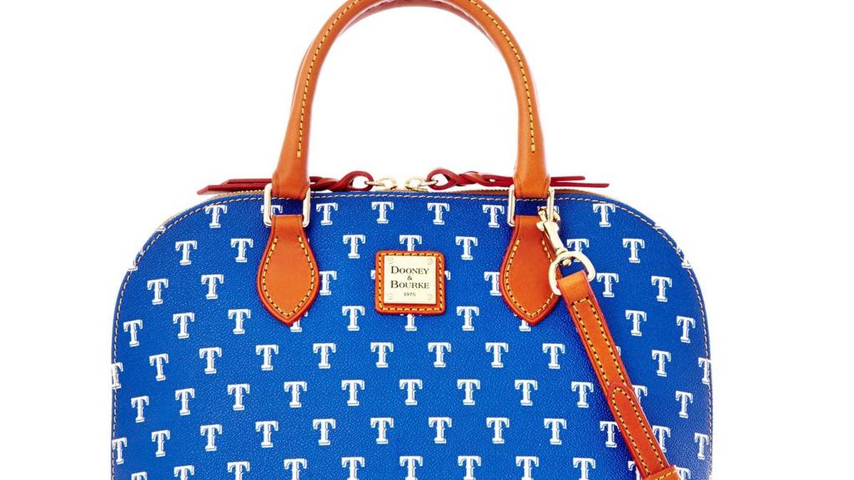 Texas fans, carry your favorite team all season long with a purse like this bright Texas Rangers’ Dooney and Bourke Signature Zip Zip Satchel. Various styles are available in the Texas Rangers Grand Slam Gift Shop at Globe Life Parkor online at www.shop.mlb.com/texasrangers. $248.99.