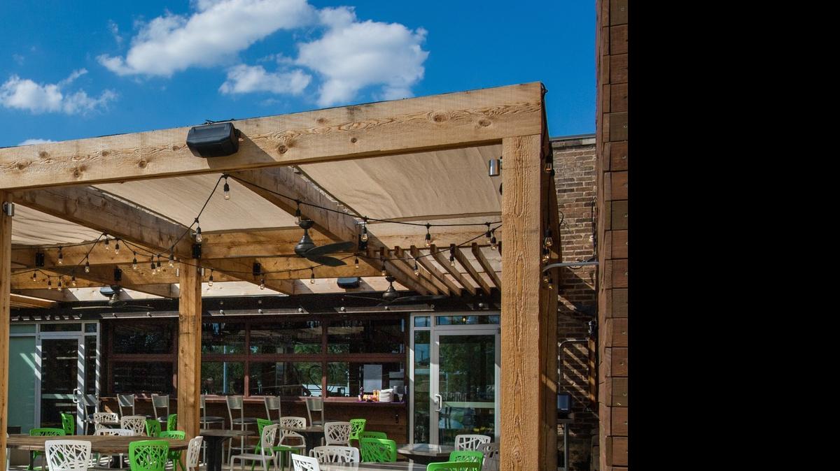
Local designer Marta Rozanich recently designed a patio that demonstrates how to use pops of yellow as an accent next to neutrals and wood. 
