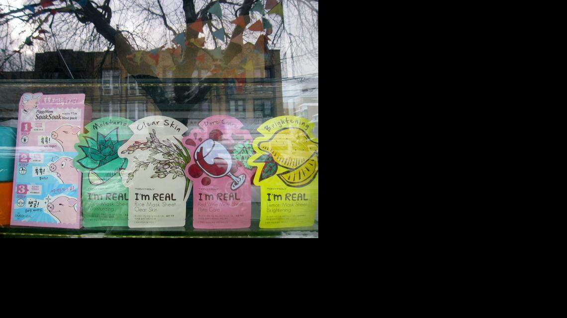 
This Jan. 9, 2015 shows Tony Moly-brand skin-care treatments, from a South Korean-based cosmetics company, and other products displayed in the window of a beauty shop in the Sunset Park neighborhood in the Brooklyn borough of New York. The Chinatown located in Lower Manhattan is New York City’s most famous Asian enclave but a section of Sunset Park has become one of the city’s biggest Chinese neighborhoods in recent years, with stores selling products rooted in a variety of Asian cultures. (AP Photo/Beth J. Harpaz) 
