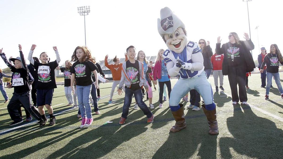 Dallas Cowboys mascot Rowdy dances with students at the Keller ISD 11th Annual School Walk for Diabetes on April 2 at the Keller ISD Athletic Complex.