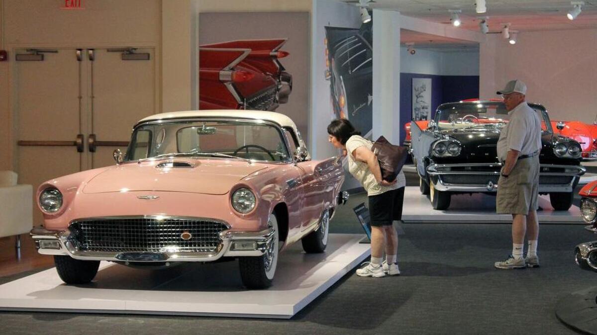 Anna and Doug Lash of Monroe, Conn., look at a 1957 Ford Thunderbird D-Code Convertible at the Newport Car Museum in Portsmouth, R.I. (