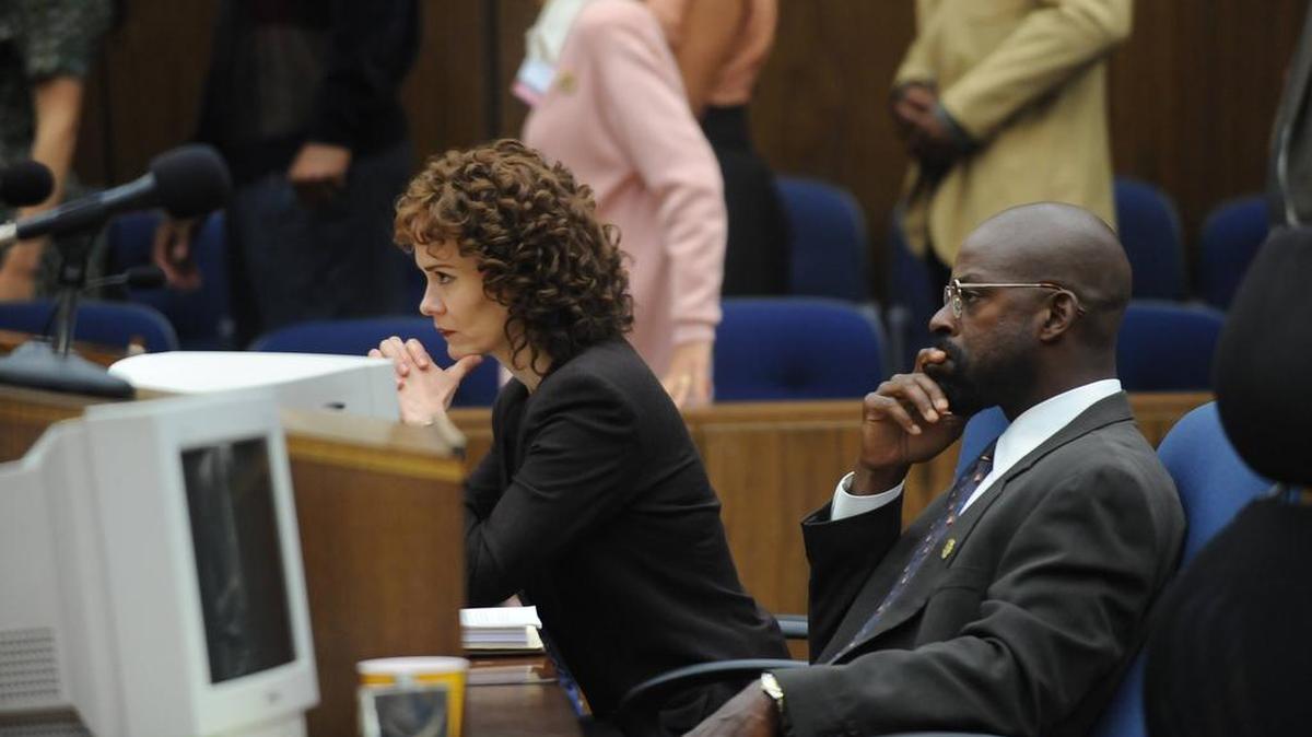 Sarah Paulson portrays Marcia Clark, left, and Sterling K. Brown portrays Christopher Darden in a scene from "The People v. O.J. Simpson: American Crime Story,"