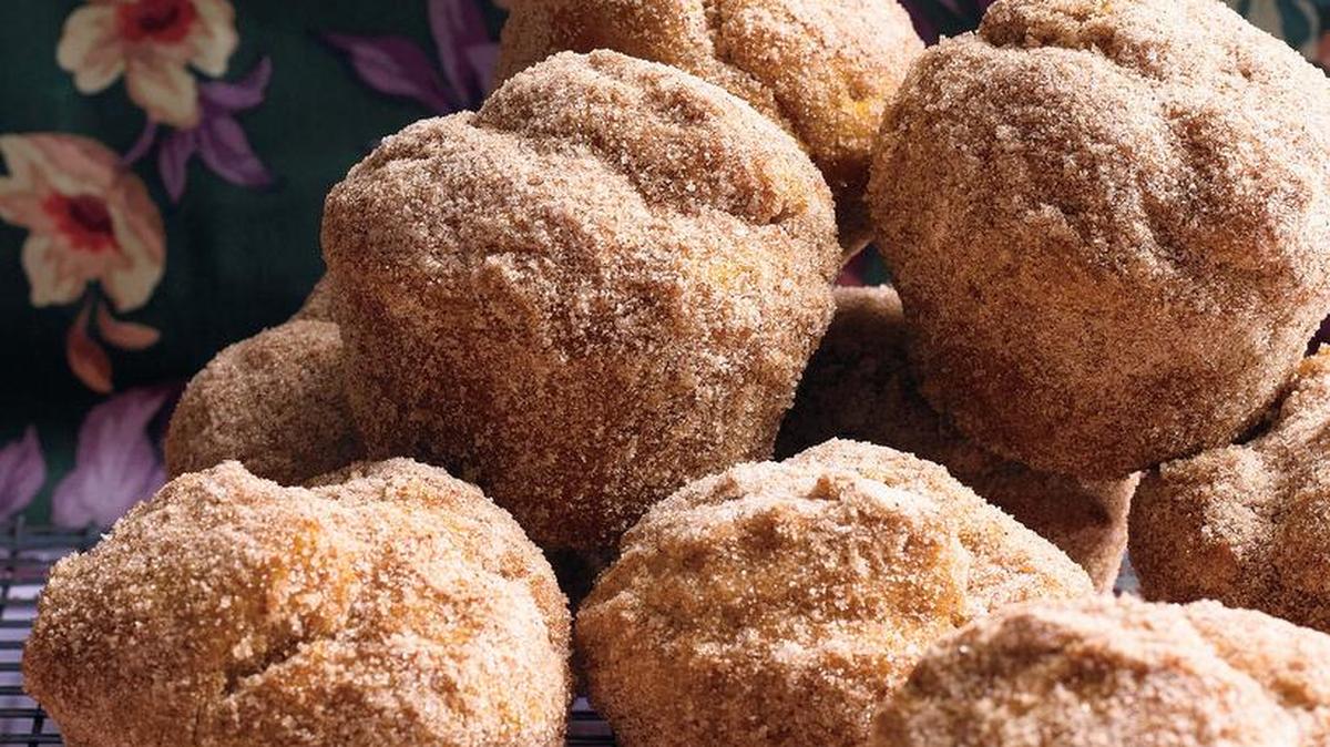 
The muffins are coated in butter and then cinnamon-sugar.


