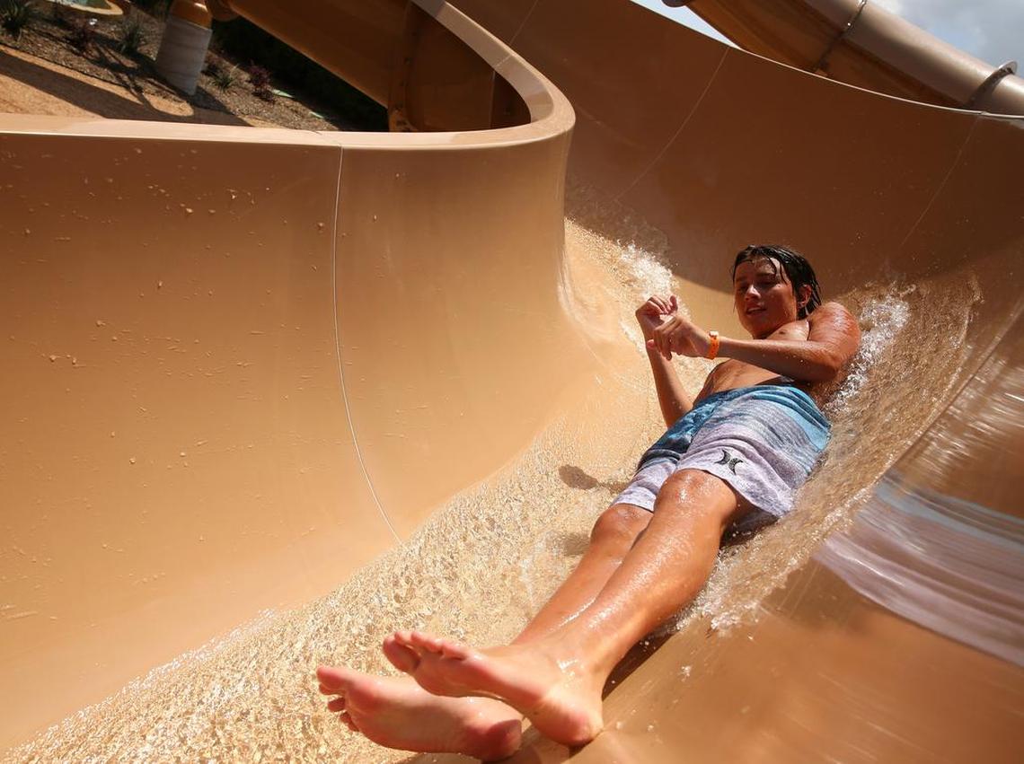 Nicholas Kuykendall, 15 of San Antonio, enjoys one of the slides in the new water park addition at Paradise Springs water park at the Gaylord Texan.