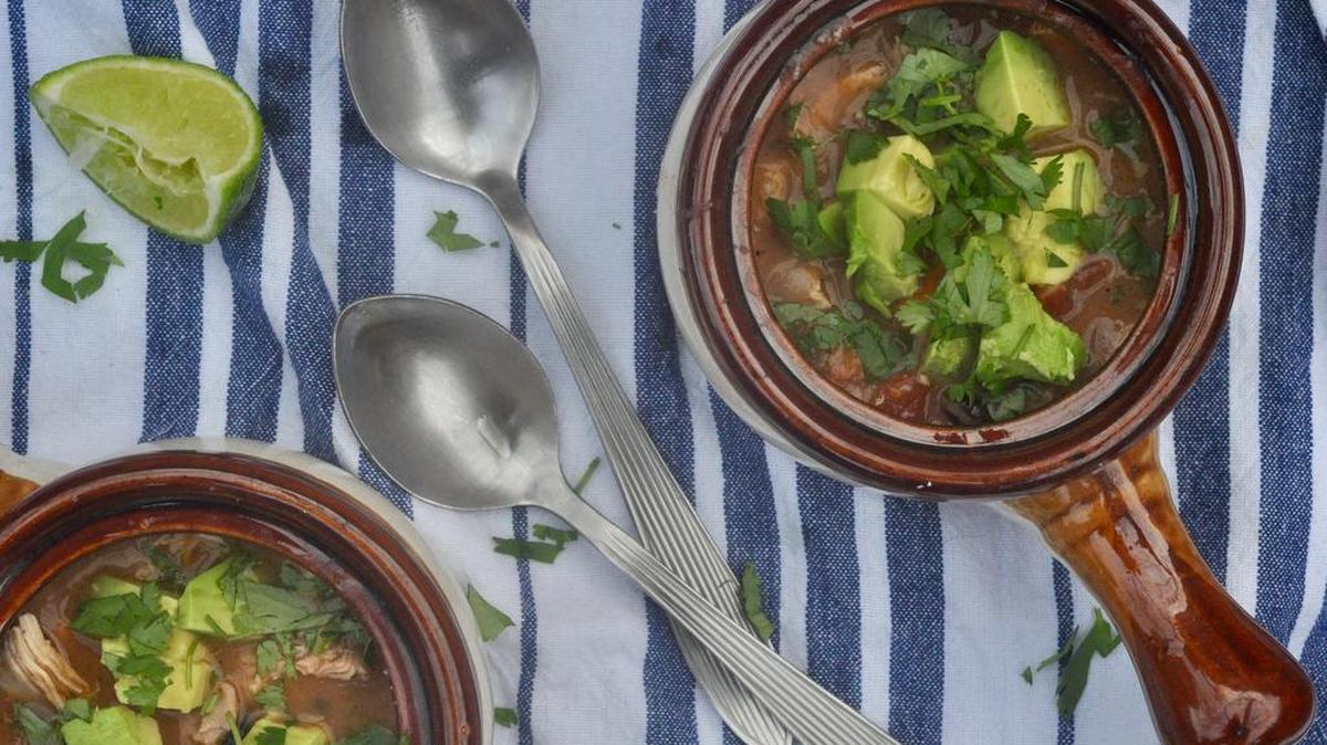 The tortillas are pureed and stirred into this hearty chicken tortilla soup remix. The broth is made slightly fiery by adding roasted poblanos, yet bright with fresh lime.