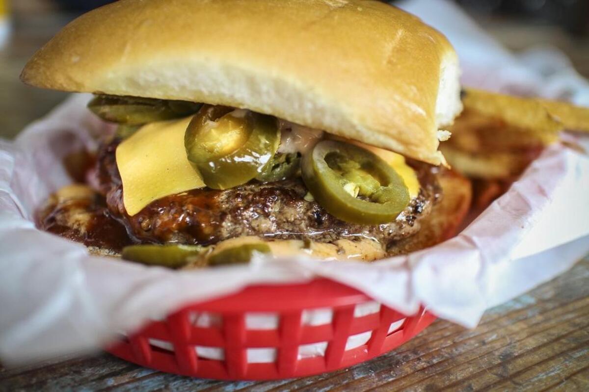 The Dutch’s hickory burger, with cheese, bacon, jalapeños, barbecue sauce and Thousand Island dressing
