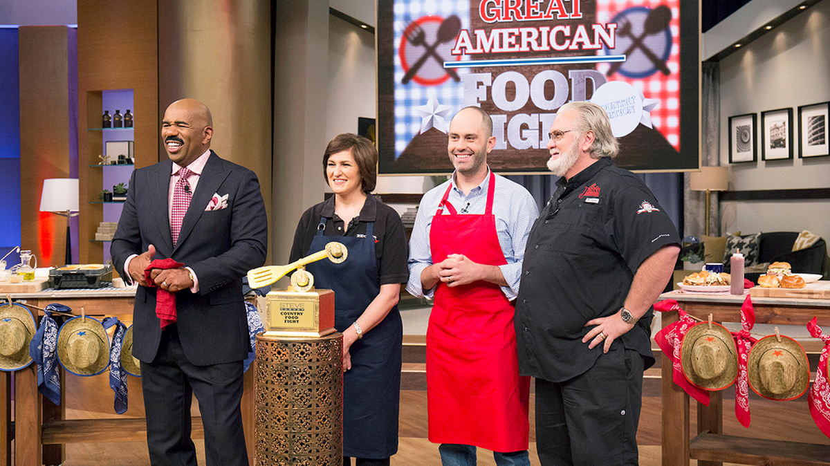From left, Steve Harvey, Katie Garner of Nashville’s Hog Heaven, Matt Dallman of Dallas’ 18th & Vine, and barbecue expert Myron Mixon on the “Great American Food Fight: Country Edition” episode of The Steve Harvey Show. In the episode, airing at 2 p.m. Sept. 8 on KXAS/Channel 5, Dallman will compete with Garner in a pulled-pork battle.