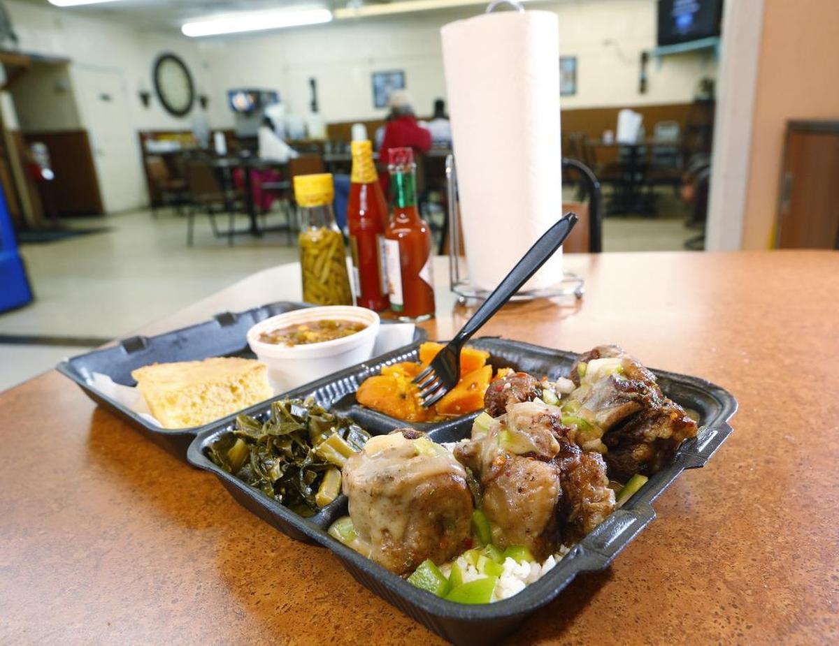 The oxtail plate with sweet potatoes, collard greens, okra and cornbread at Stormie Mondays on East Berry Street in Fort Worth