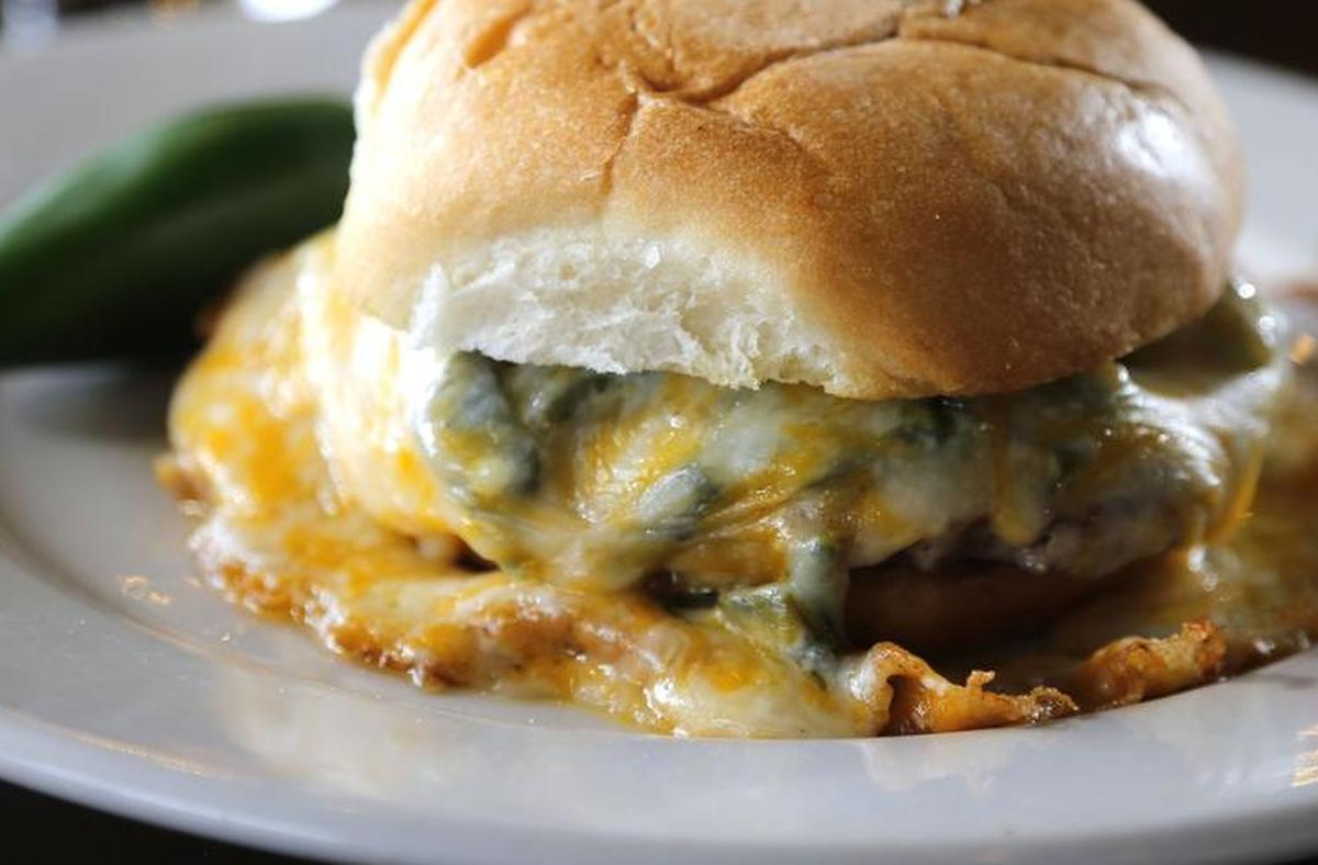 The Fuego Burger’s namesake green-chile cheeseburger, seen Sept. 16, 2015.