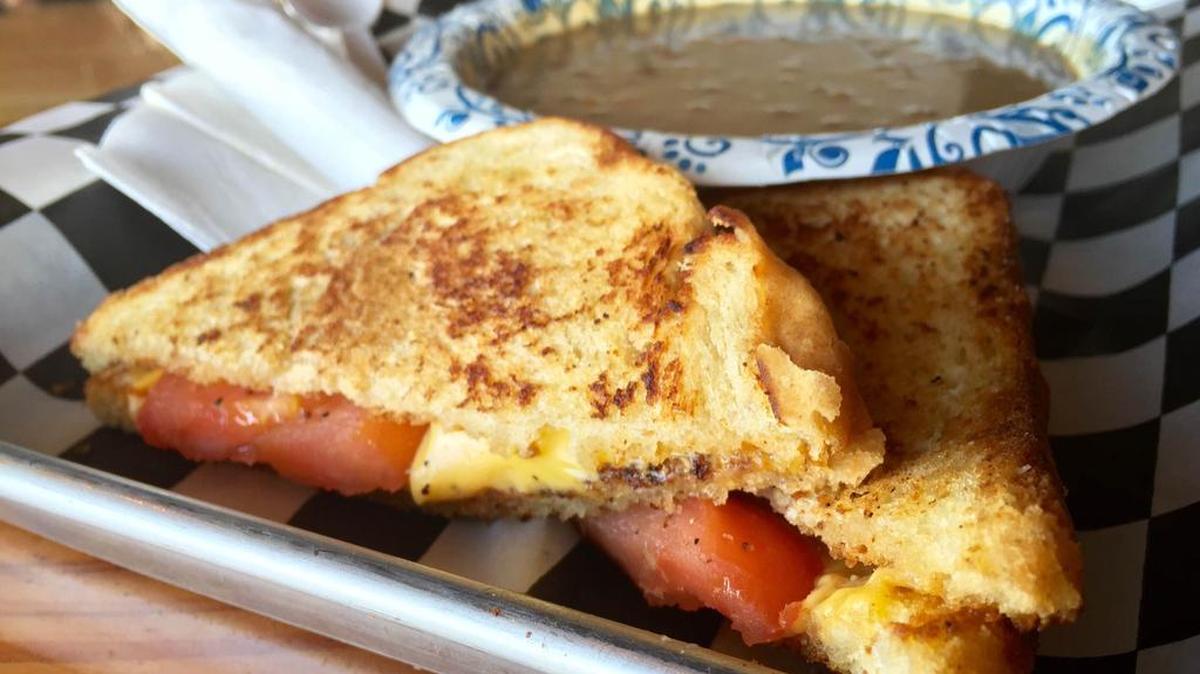 A grilled-cheese sandwich with 15-bean soup costs $8.99 at Pouring Glory.