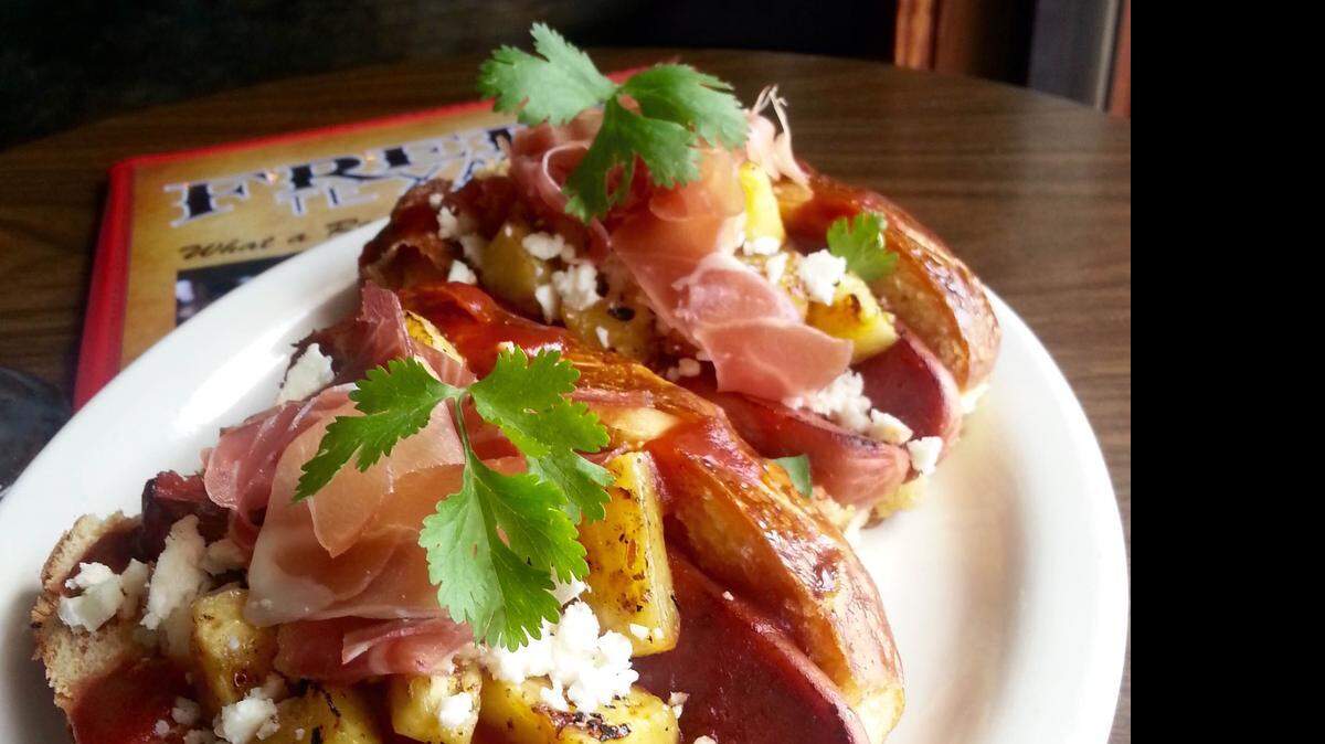 
The “Aloha Dawg” with Italian ham and grilled pineapple is the hot dog of the month at Fred’s Texas Cafes.
