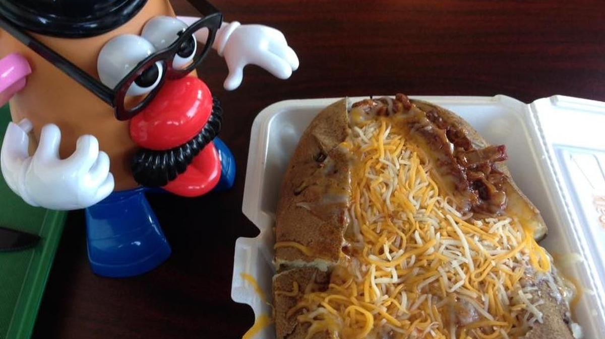 Mr. Potato Head accompanies the COWch Potato (shredded brisket, barbecue sauce, cheddar-Jack mix) at Spudwinkles Deli in Fort Worth. Every table has a Mr. or Mrs. Potato Head on it.