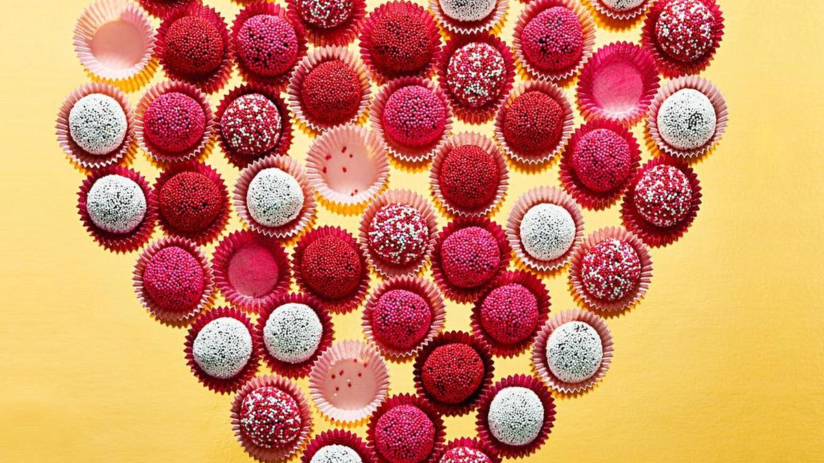 These beauties use bitter chocolate and cocoa to balance out the rich condensed milk. Then they’re rolled in cheery sprinkles.