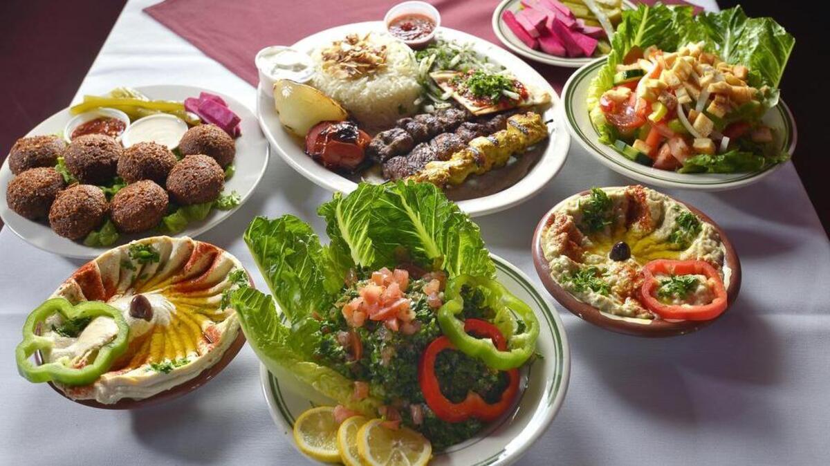 Al-Amir Restaurant in Arlington menu items including hummus, baba ghanoush, appetizer plate, falafel, tabbouleh, fattoush and mixed-grill kebabs on Wednesday, May 25, 2016.