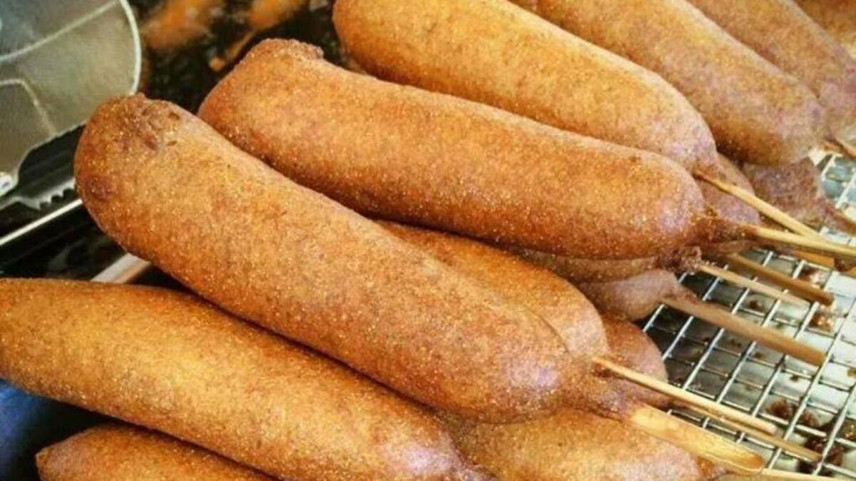 The hand-dipped, deep-fried corn dogs are called the original State Fair food.